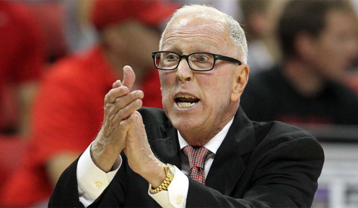 San Diego State Coach Steve Fisher says he'll be back with the Aztecs next year.