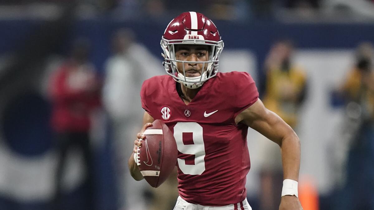 Alabama quarterback Bryce Young runs against Georgia.