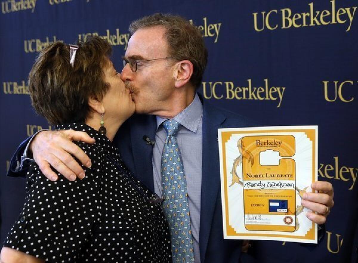 UC Berkeley professor Randy Schekman kisses his wife, Nancy Walls, during a news conference Monday announcing his place among this years recipients of the Nobel Prize in physiology or medicine.