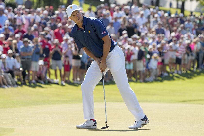 Jordan Spieth reacts to his putt on the 15th green during their foursomes match at the Presidents Cup golf tournament at the Quail Hollow Club, Saturday, Sept. 24, 2022, in Charlotte, N.C. (AP Photo/Chris Carlson)