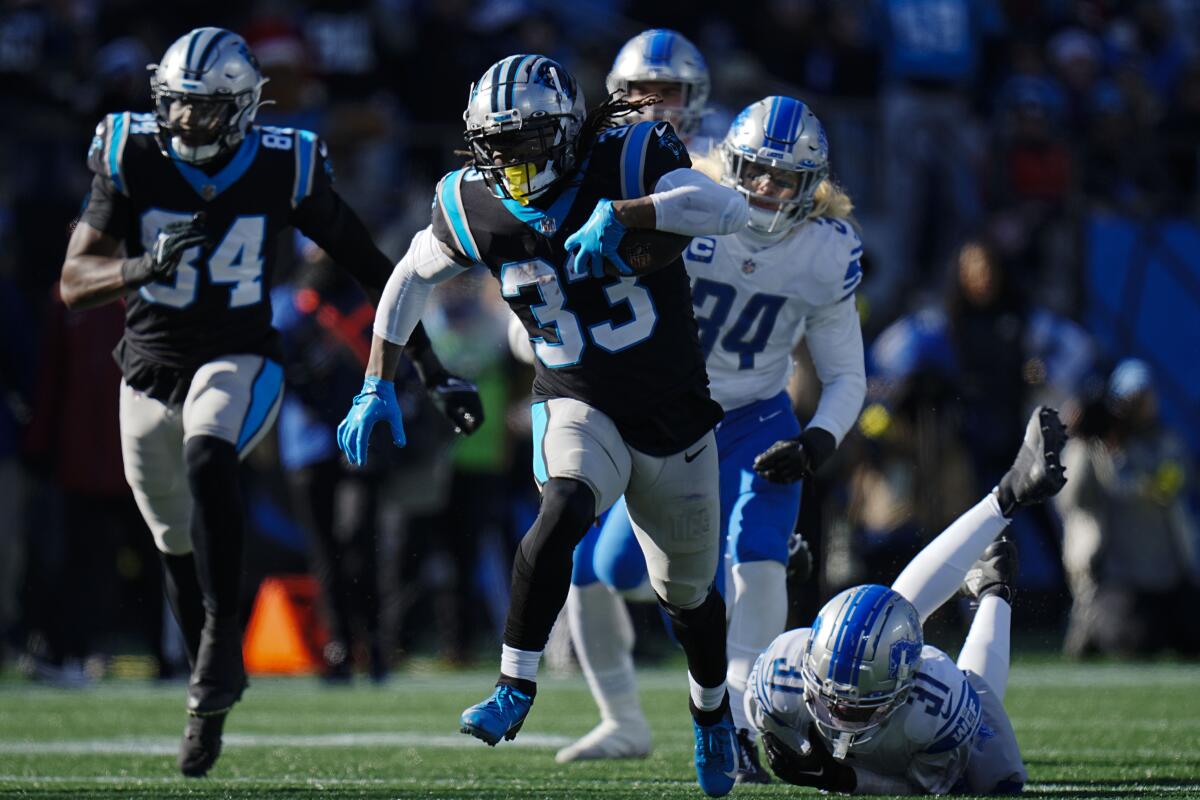Carolina Panthers running back D'Onta Foreman carries the ball against the Detroit Lions.
