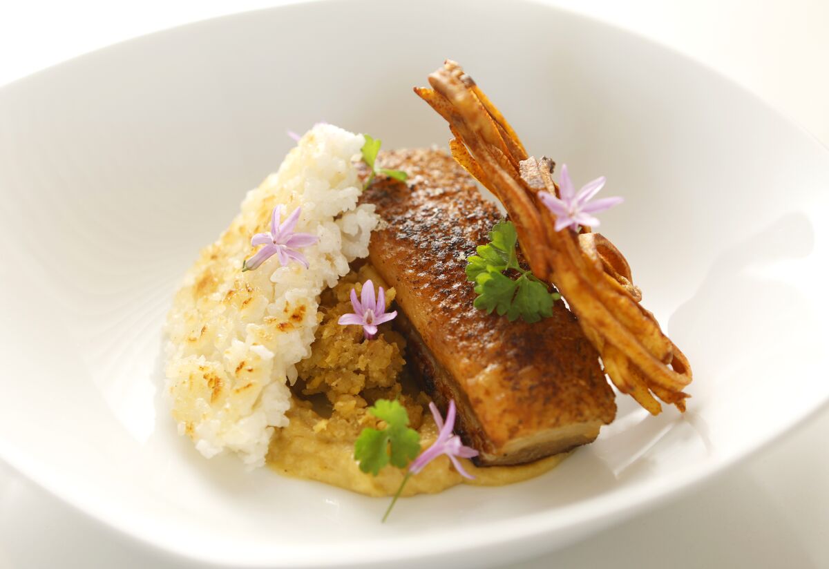 A pork belly and rice dish created by Daniela Martinez.