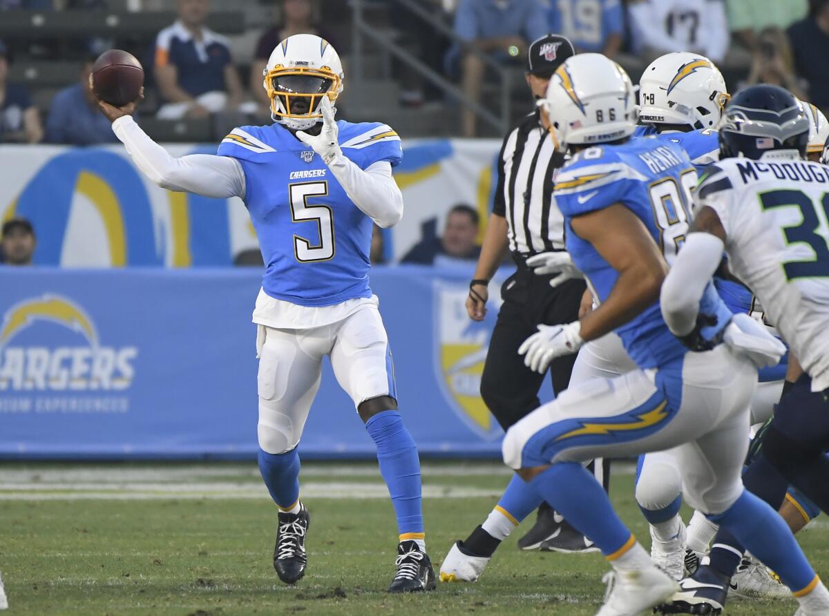 Chargers quarterback Tyrod Taylor looks to pass against the Seahawks in the first quarter Aug. 24, 2019.