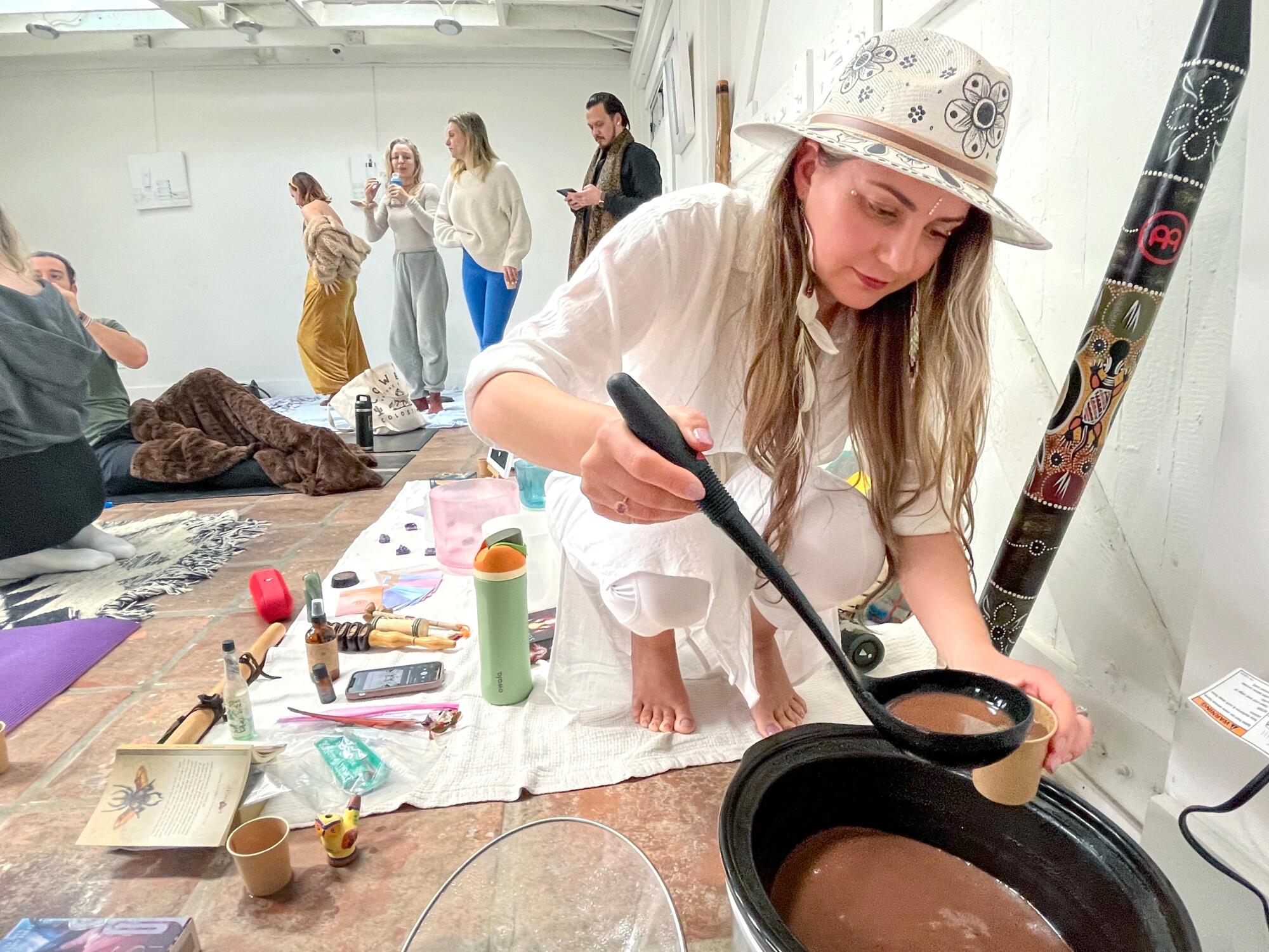 A woman with a cocoa hat of a pot.