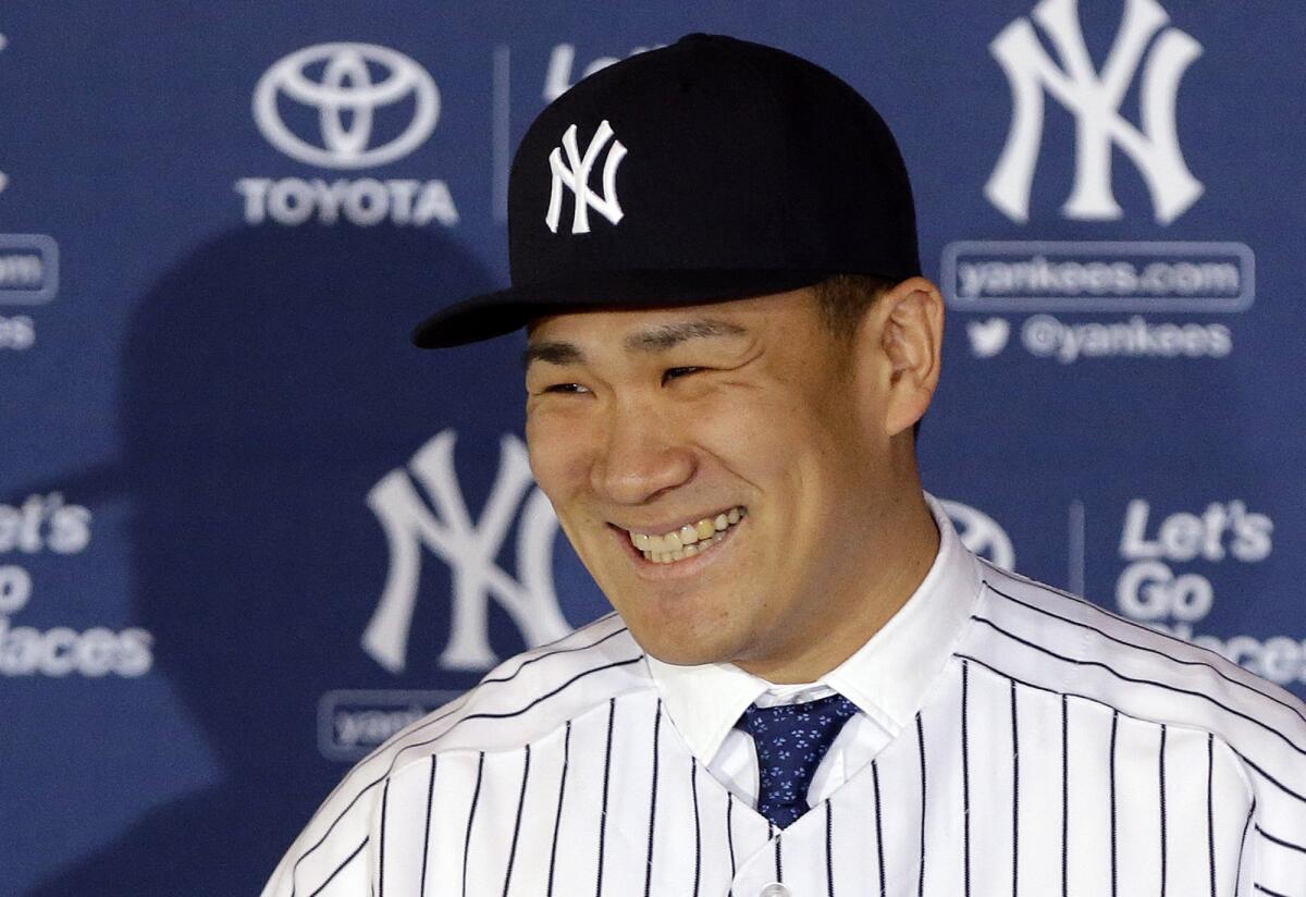 New York Yankees pitcher Masahiro Tanaka of Japan speaks during a news conference at Yankee Stadium on Tuesday.