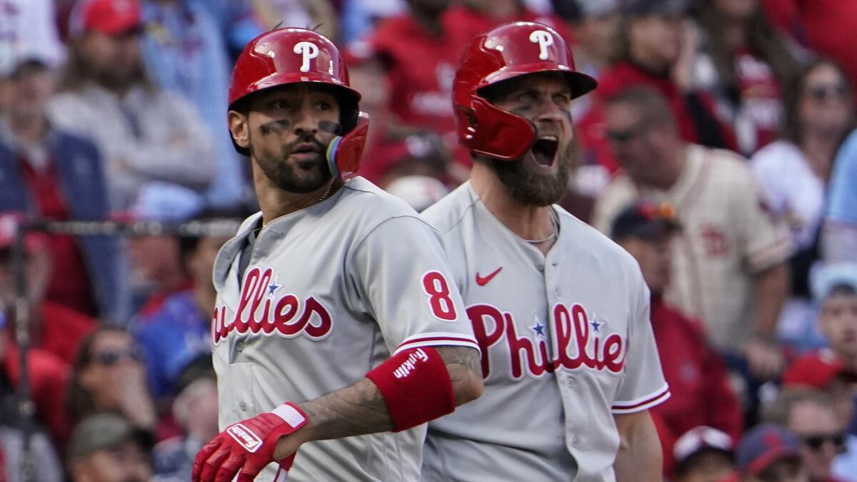 Phillies score 6 in the 9th to down Cardinals in opening game of