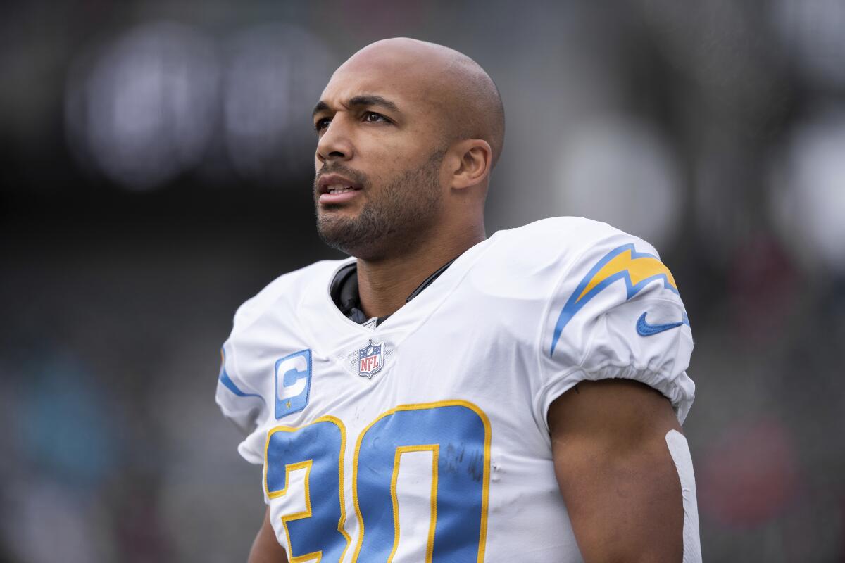 Chargers running back Austin Ekeler walks down the sideline during a game at Cincinnati on Dec. 5, 2021.