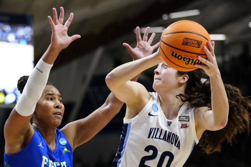 Villanova's Maddy Siegrist, right, looks to shoot against Florida Gulf Coast's Kierra Adams during the second half of a second-round college basketball game in the NCAA Tournament, Monday, March 20, 2023, in Villanova, Pa. (AP Photo/Matt Rourke)