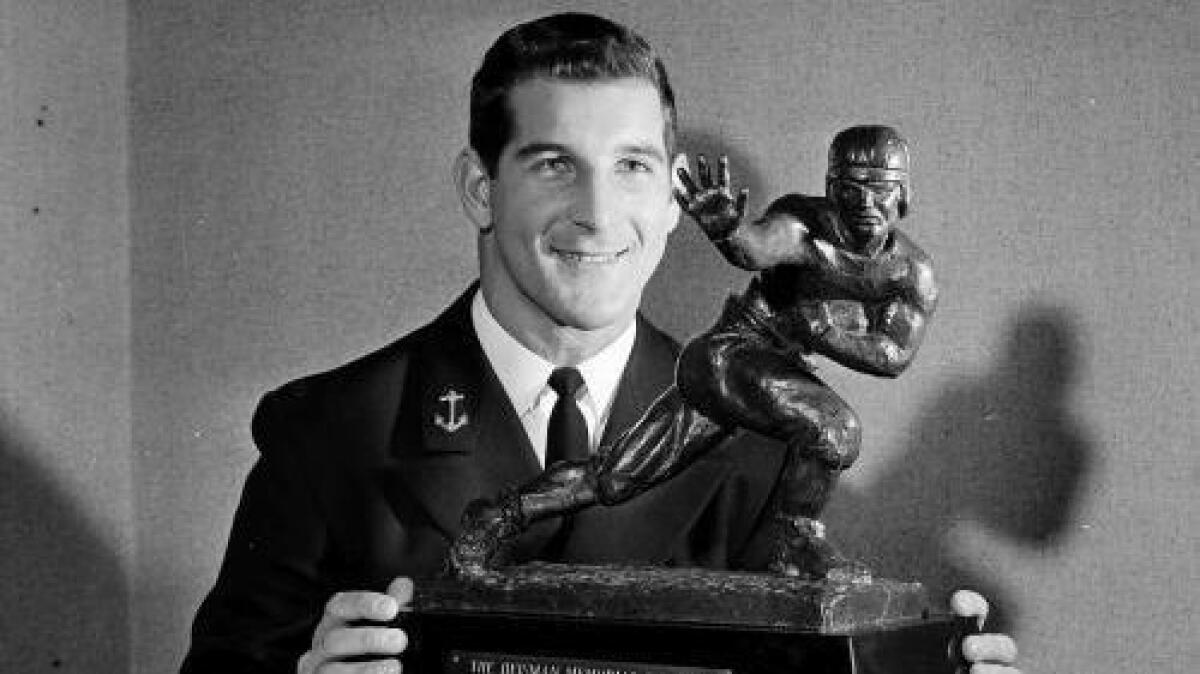 All-American halfback Joe Bellino of Navy is shown with the Heisman Trophy at a luncheon in New York on Dec. 8, 1960.