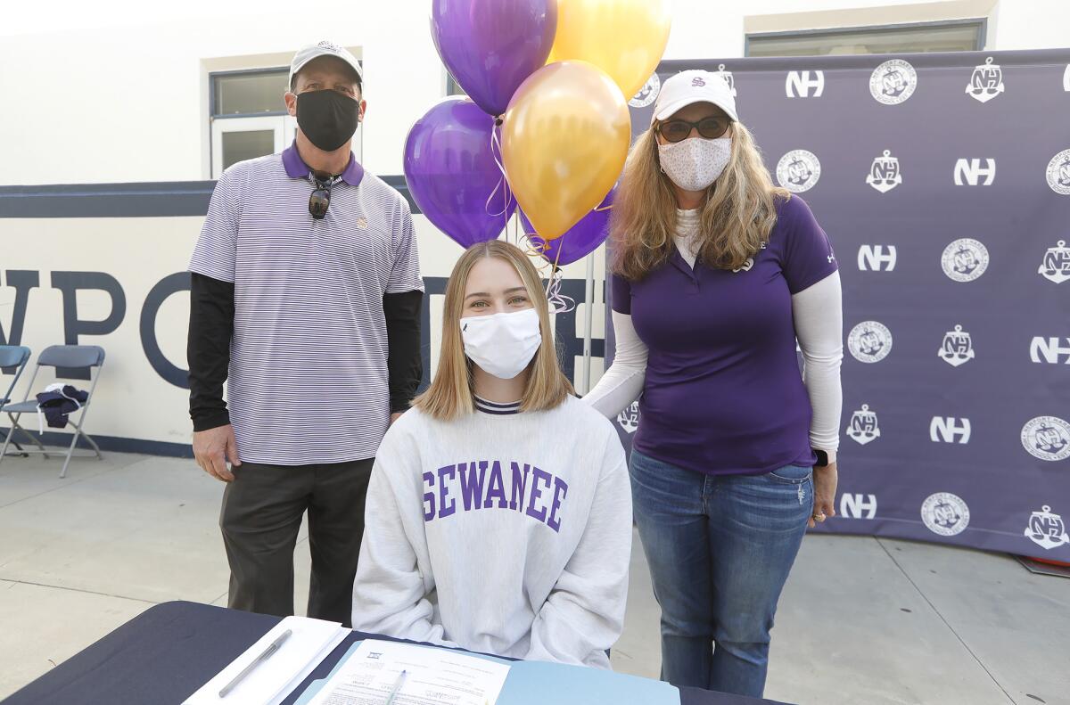 Newport Harbor golfer Sabrina Nesbitt sits with her parents Jon and Candace after signing to attend Sewanee on Wednesday.