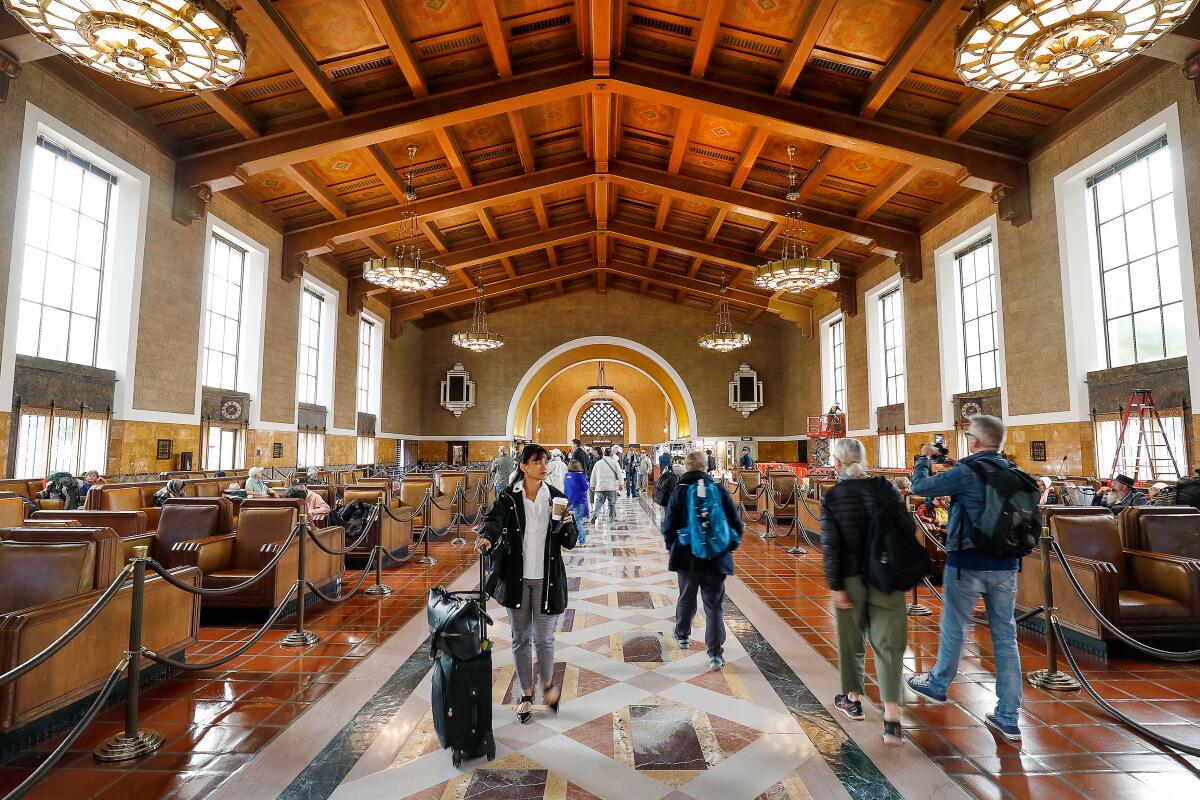 People walk through the interior of Union Station