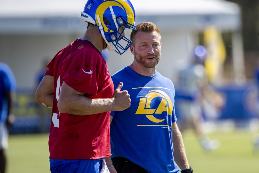 IRVINE, CA - JULY 28, 2021: Rams head coach Sean McVay chats with the Rams new starting quarterback Matthew Stafford (9) on the first day of training camp at UC Irvine on July 28, 2021 in Irvine, California.(Gina Ferazzi / Los Angeles Times)