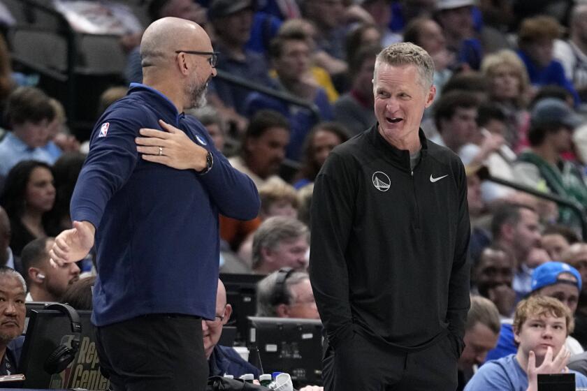 Dallas Mavericks head coach Jason Kidd, left, and Golden State Warriors head coach Steve Kerr.