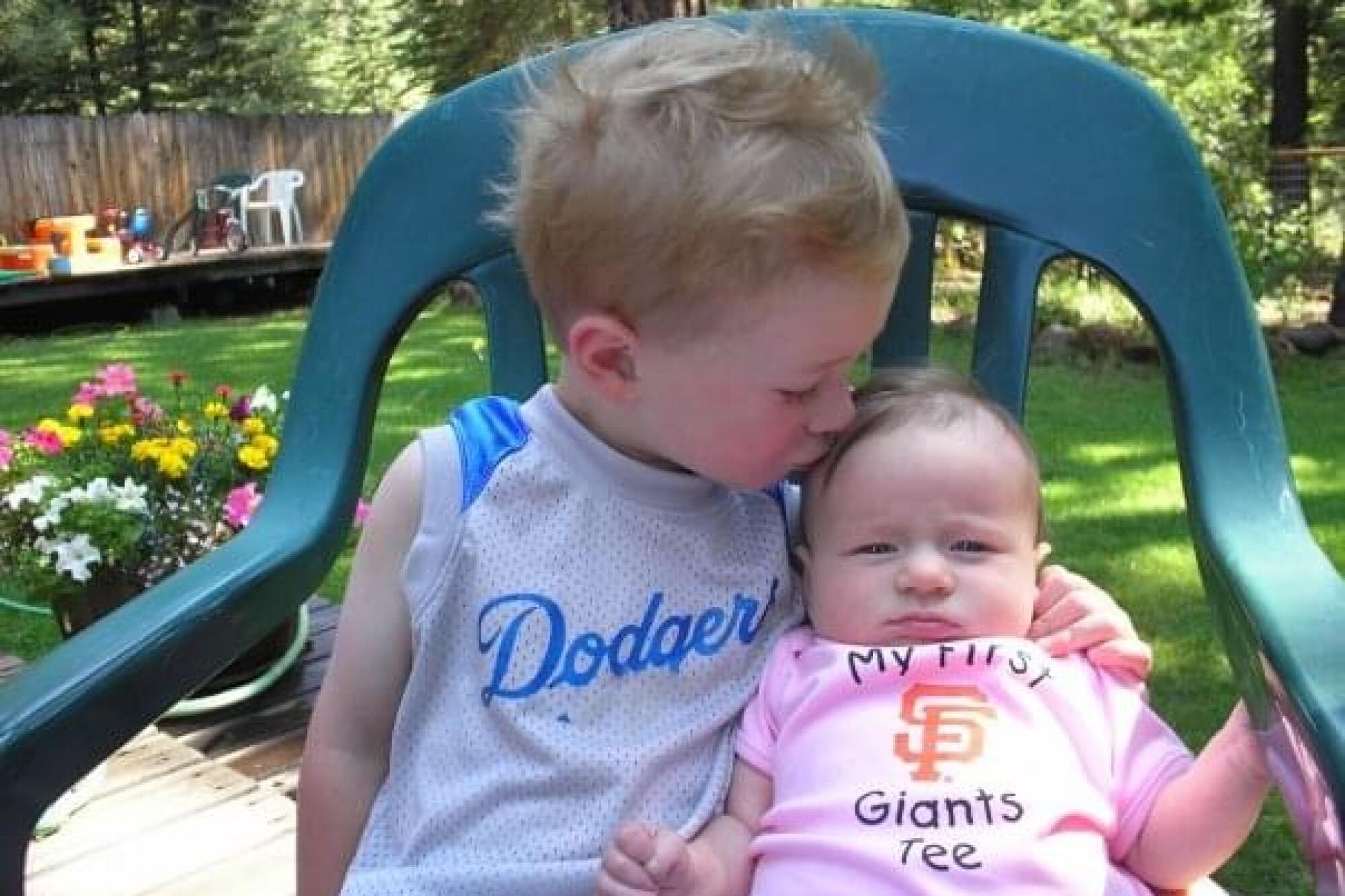 The children of Scott Green, a Dodger fan who married a Giants fan, are carrying on the family rivalry.