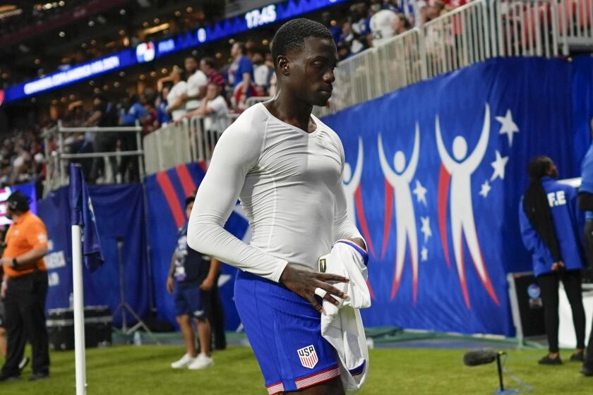 Tim Weah of the United States leaves the field after receiving a red card during a Copa America.