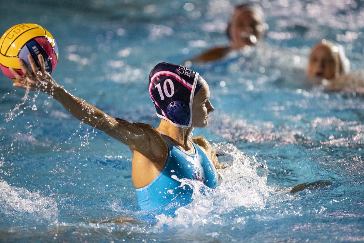 Corona del Mar's Lily Britt winds up for a shot during the second Battle of the Bay rivalry match on Thursday.