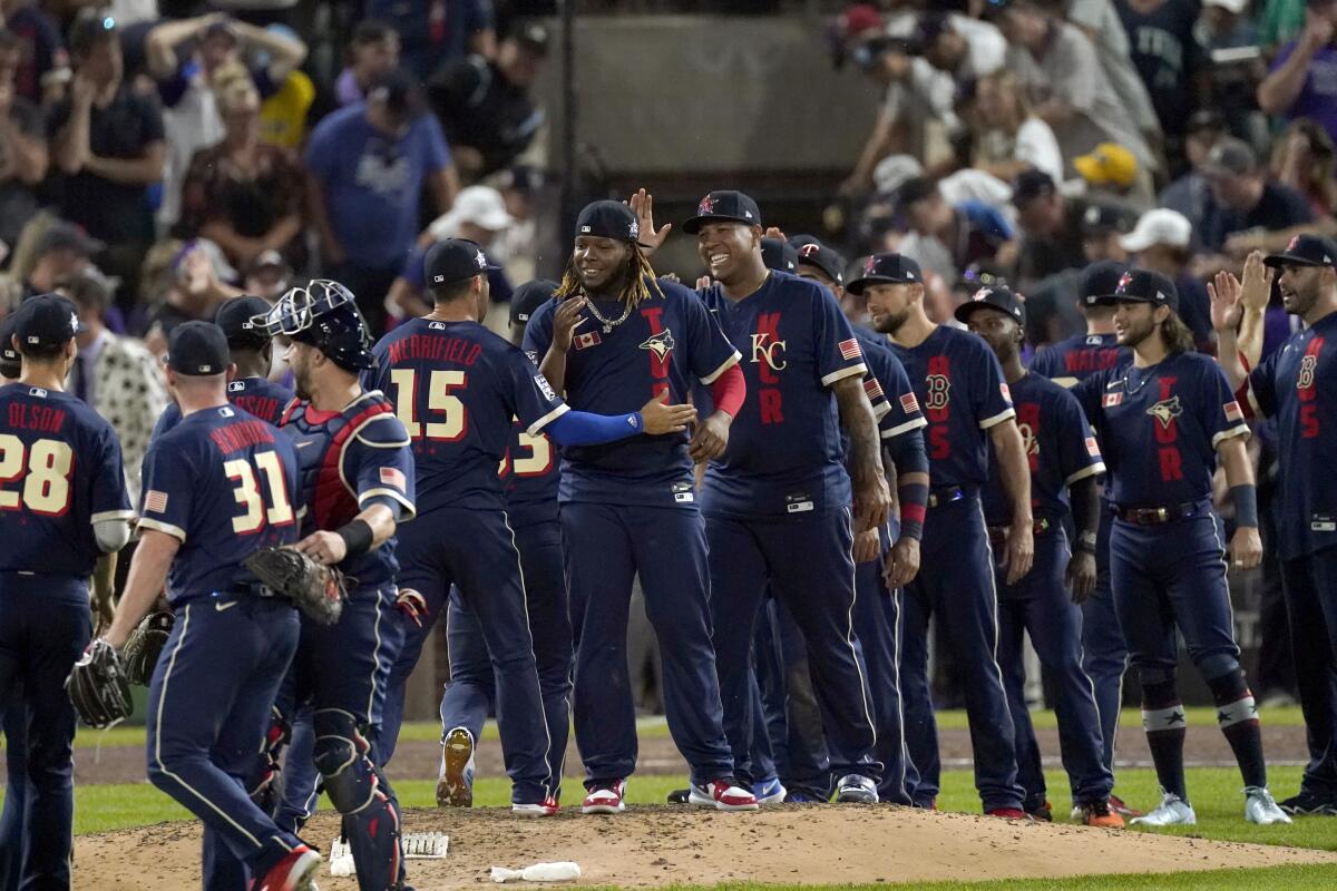 American League players celebrate after the MLB All-Star baseball game, Tuesday, July 13, 2021, in Denver. The American League defeated the National League 5-2. (AP Photo/Gabriel Christus)
