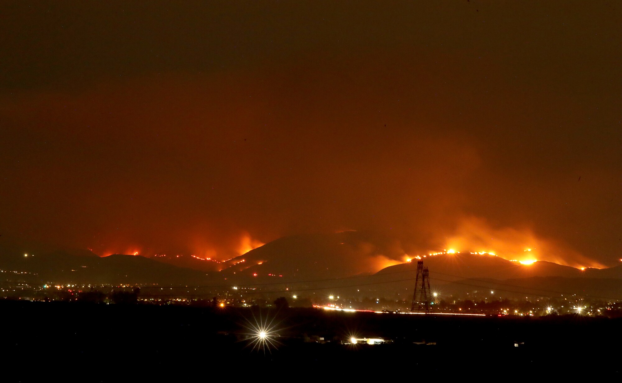 The Fairview fire lights up the night sky over Hemet