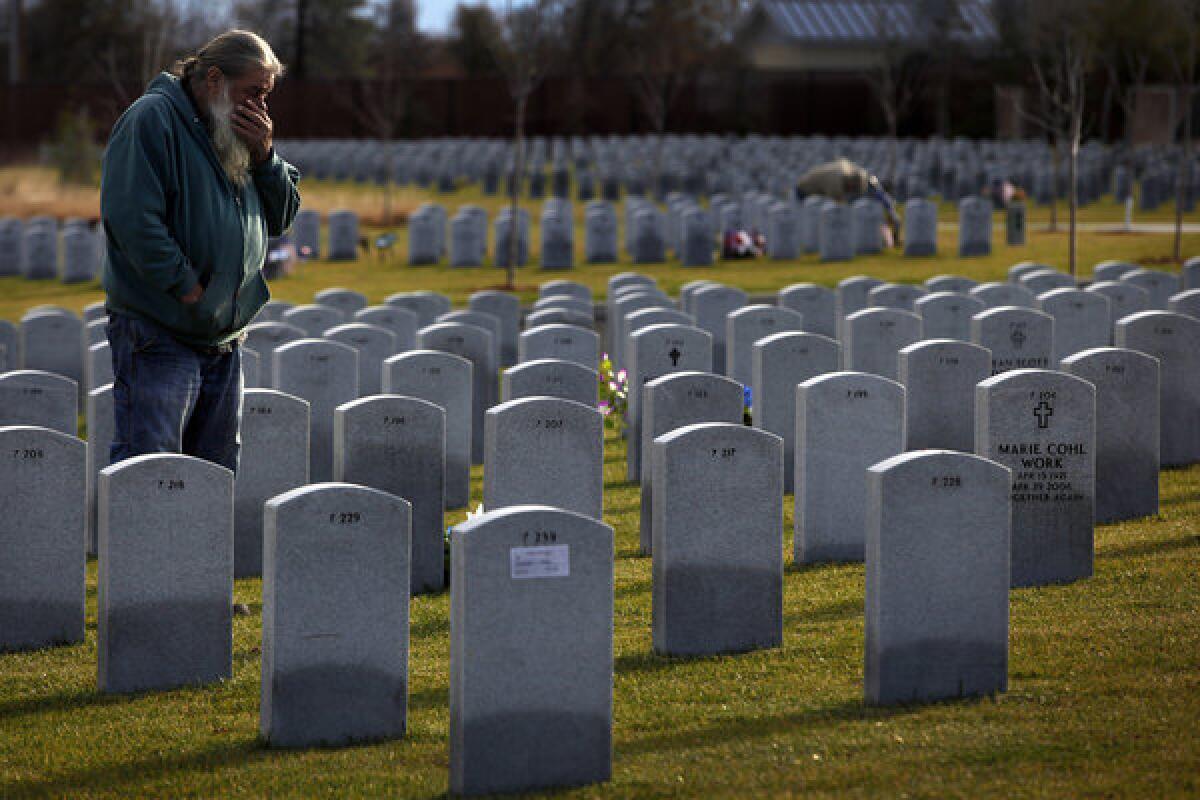 Mark Tyree Sr. visits his son's grave. "I grieve every day now," he said. "I don't want it to go away."