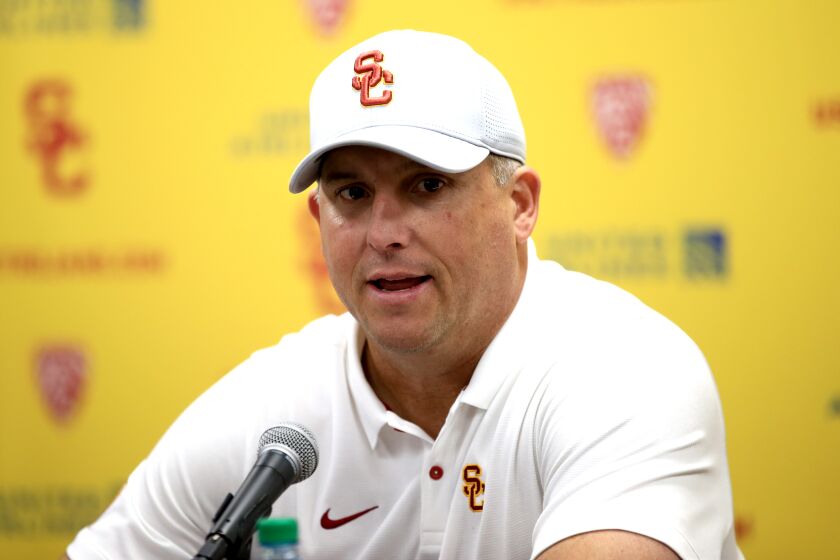 LOS ANGELES, CALIFORNIA - NOVEMBER 23: Head coach Clay Helton of the USC Trojans speaks to the media after defeating the UCLA Bruins 52-35 in a game at Los Angeles Memorial Coliseum on November 23, 2019 in Los Angeles, California. (Photo by Sean M. Haffey/Getty Images)