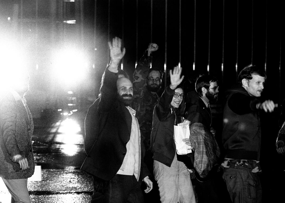 Barry Rosen and other American hostages wave to the media at Algiers airport on Jan. 21, 1981.