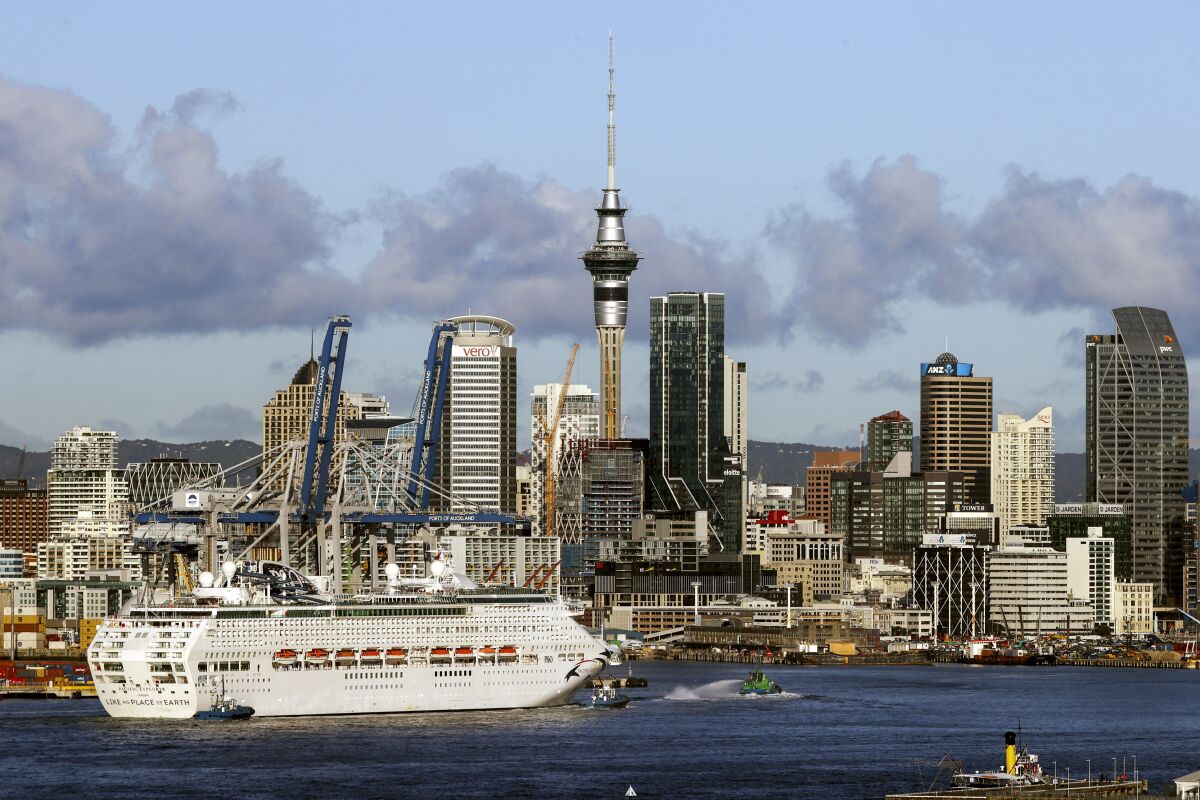 The Pacific Explorer sails into the Waitemata Harbour, in Auckland, New Zealand, Friday, Aug. 12, 2022. New Zealand has welcomed the first cruise ship to return since the coronavirus pandemic began, signaling a long-sought return to normalcy for the nation's tourism industry. (Brett Phibbs/New Zealand Herald)