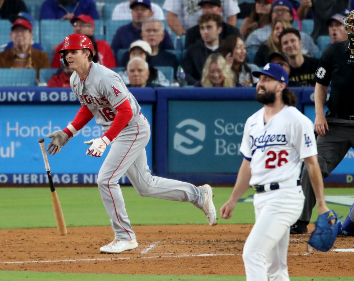 Mickey Moniak, left, hits a three-run home run off Dodgers pitcher Tony Gonsolin at Dodger Stadium on July 7.