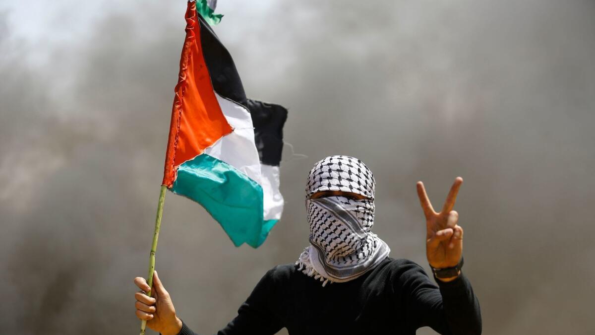A Palestinian demonstrator during a protest April 6 on the Gaza-Israel border, east of Gaza City.