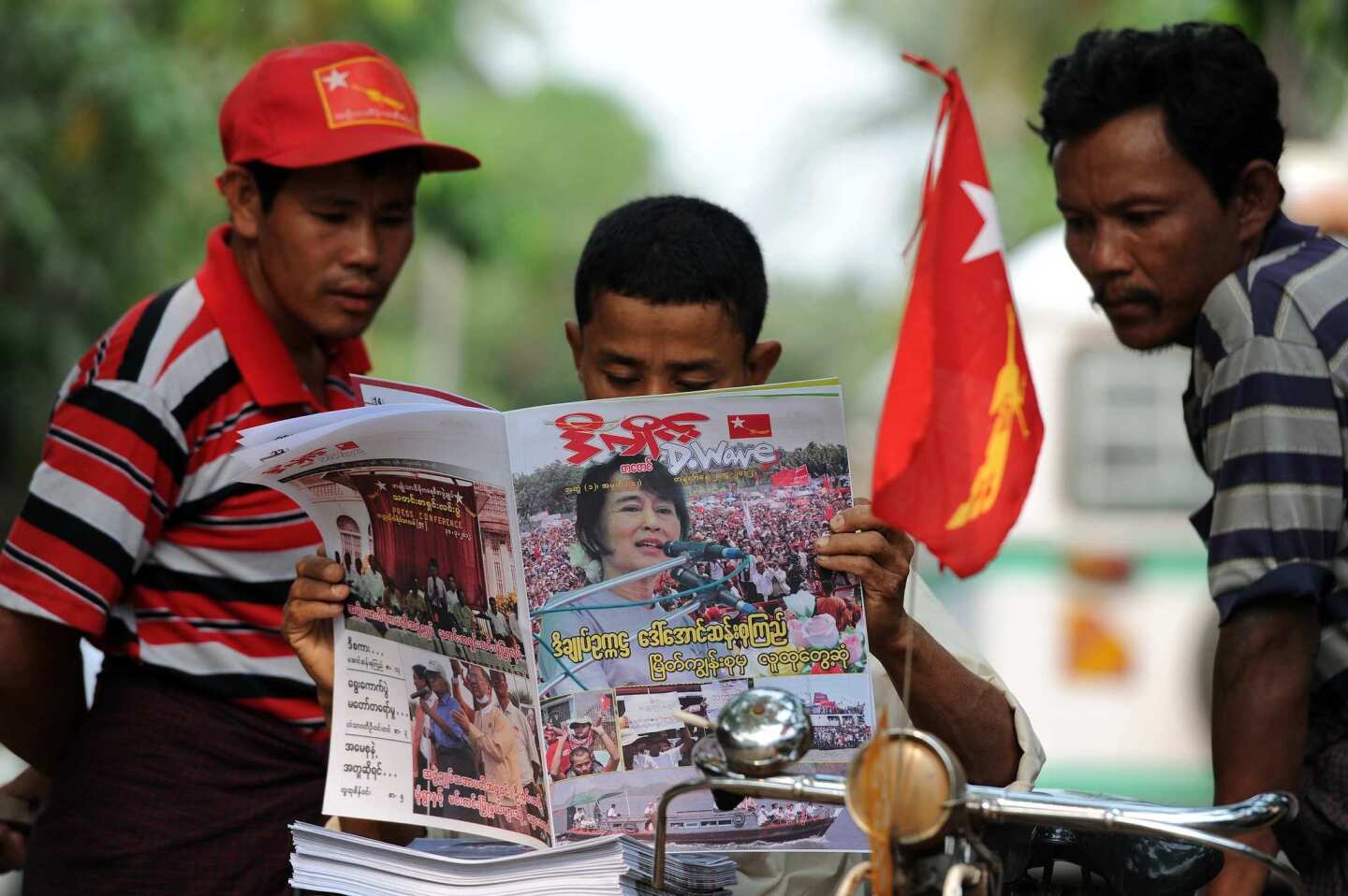 Myanmar people catch up on election news