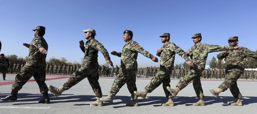 New members of the Afghan National Army march during their graduation ceremony at the Afghan Military Academy in Kabul, Afghanistan, on Nov. 23.
