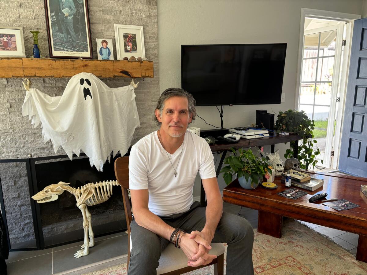 Patrick Combs relaxes in the living room of his southern Carlsbad home.