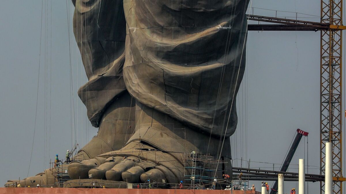 Indian workers at the construction site of the Statue of Unity a week before the unveiling Wednesday.