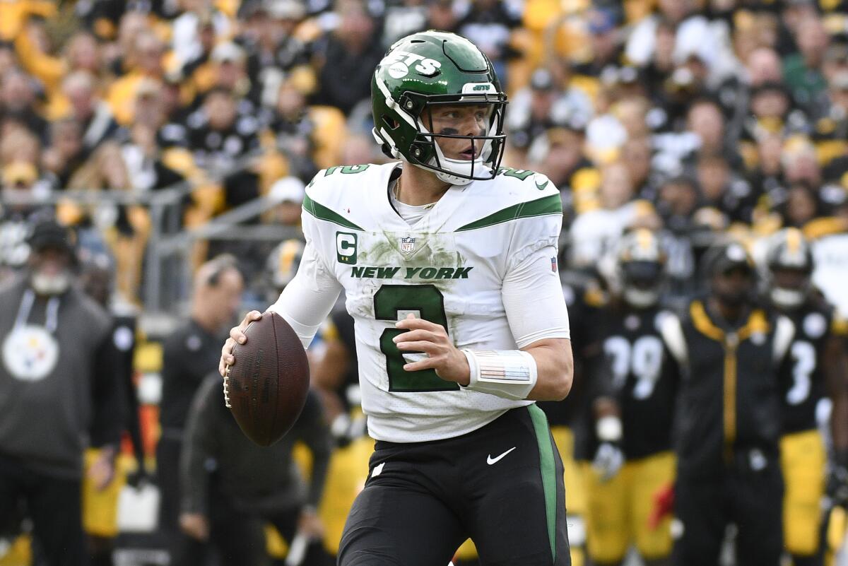 New York Jets quarterback Zach Wilson (2) looks to pass against the Pittsburgh Steelers during the second half of an NFL football game, Sunday, Oct. 2, 2022, in Pittsburgh. (AP Photo/Don Wright)