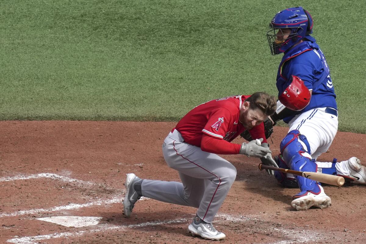 Angels' Taylor Ward carted off after being hit in face in loss