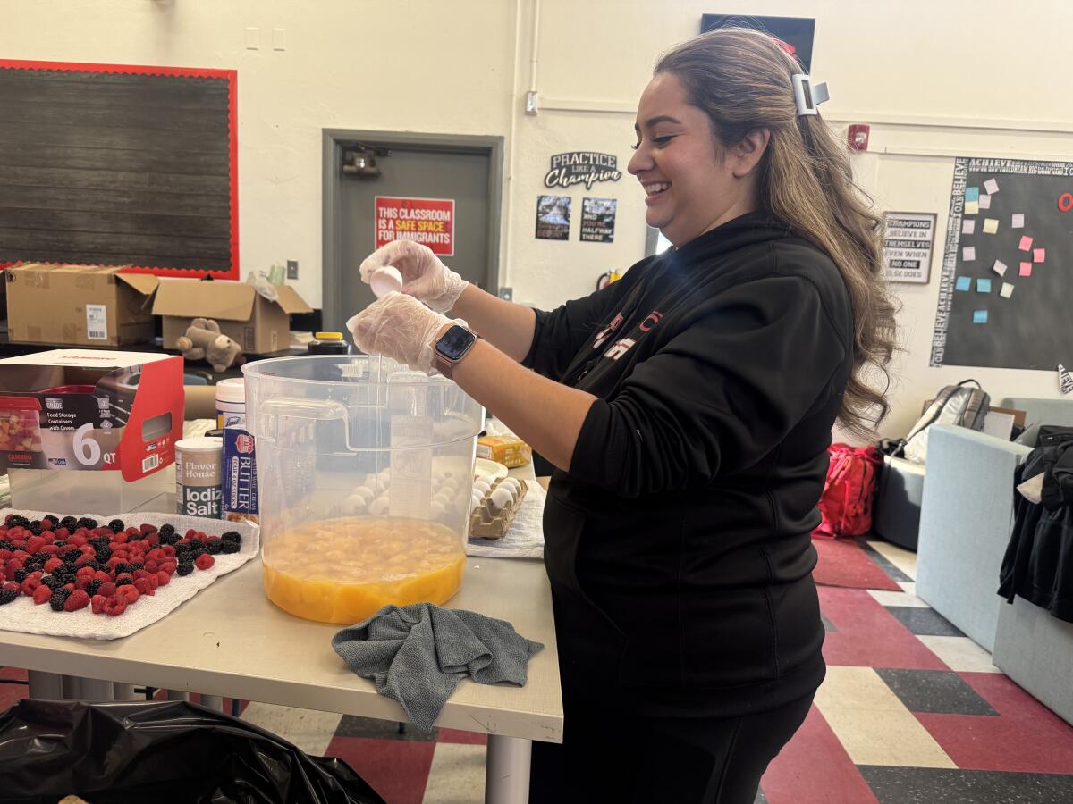 On Thanksgiving, Cleveland soccer group practices, then feasts on 180 eggs, 25 kilos of pancake combine 1 Elizabeth Guzman, wife of Cleveland football coach Mario Guzman, cracks one of 180 eggs Thursday morning.