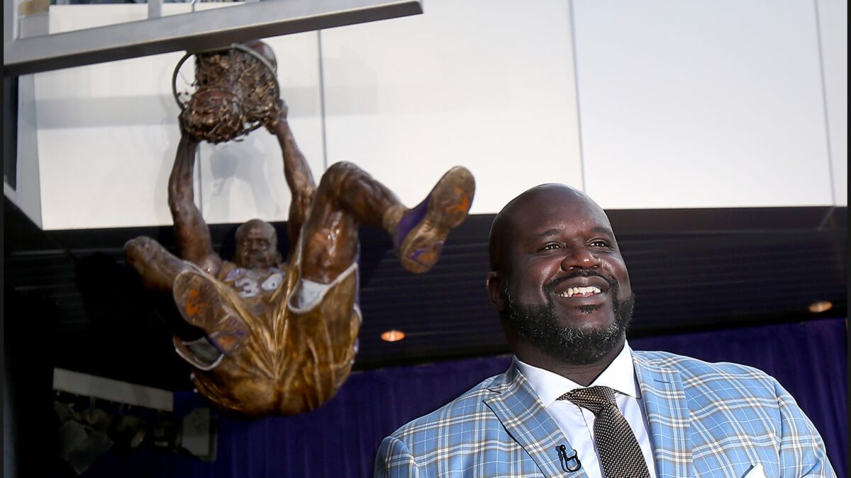 Former Lakers center Shaquille O'Neal is all smiles after the unveiling of his statue outside Staples Center.