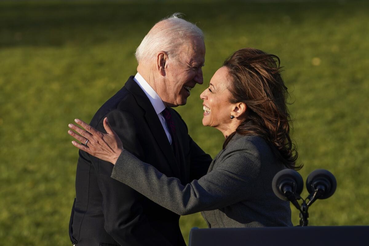 President Biden hugs Vice President Kamala Harris on the South Lawn of the White House