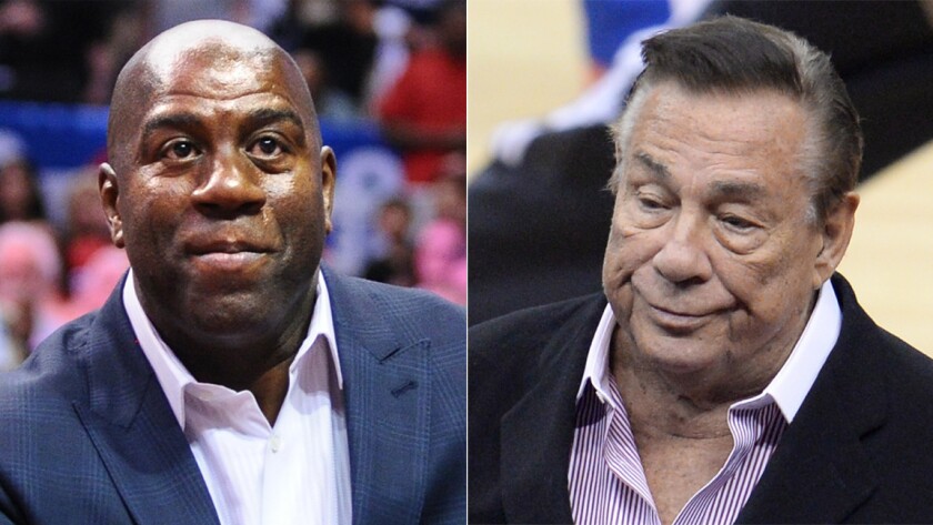 Clippers owner Donald Sterling, right, said in an interview with CNN's Anderson Cooper that aired Monday that he didn't think Lakers great Magic Johnson is "a good example for the children of Los Angeles."