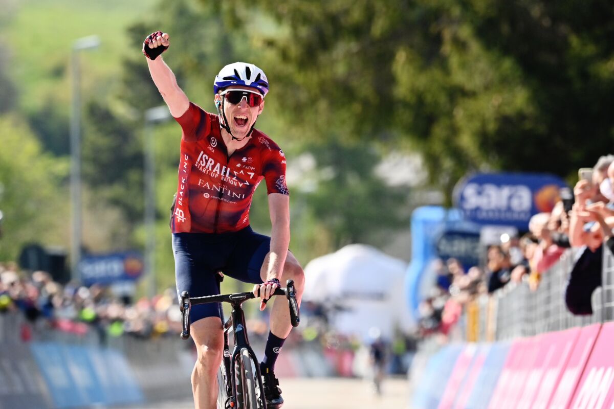 Ireland's Daniel Martin celebrates after winning the 17th stage of the Giro d'Italia cycling race, from Canazei to Sega Di Ala, Italy, Wednesday, May 26, 2021. (Massimo Paolone/LaPresse via AP)