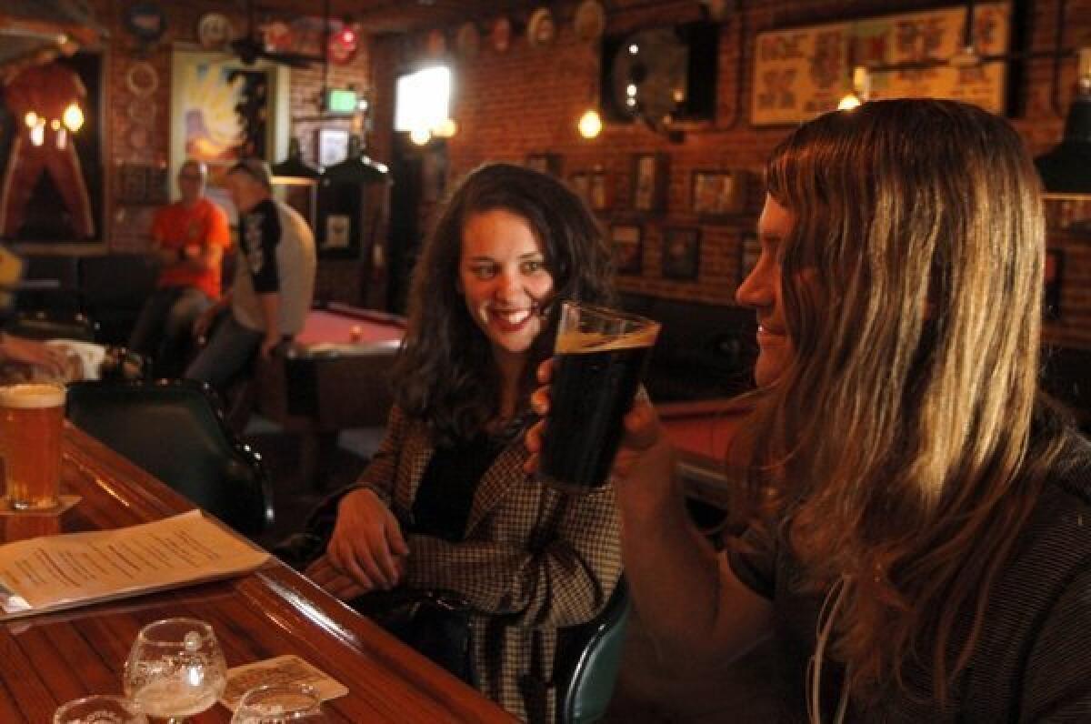 Samantha Cohen and Alex Castle enjoy a cold beer at the Glendale Tap.