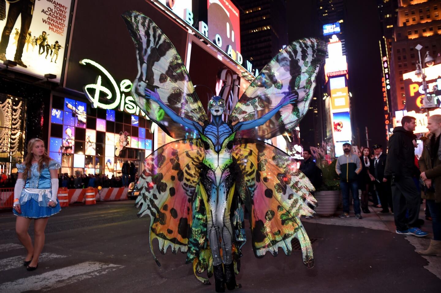 Heidi Klum spreads her wings as a colorful butterfly on Halloween at New York's Time Square.
