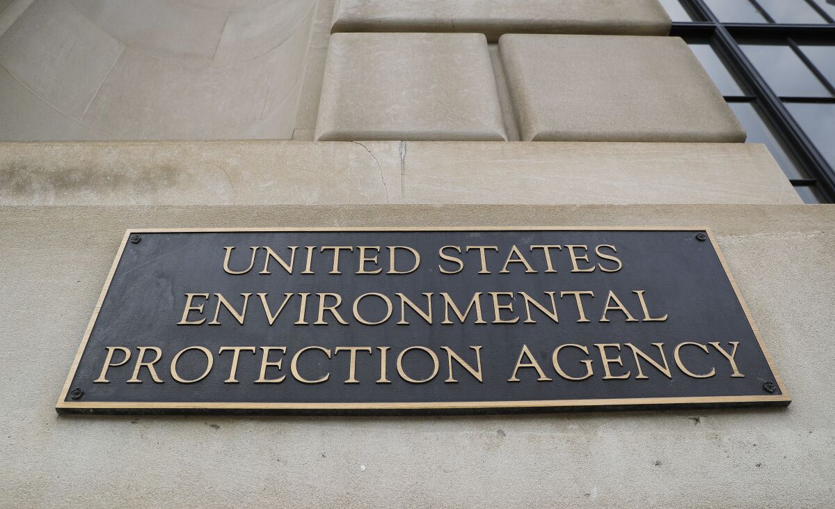 FILE - In this Sept. 21, 2017, file photo, the Environmental Protection Agency (EPA) Building is shown in Washington. Two high-ranking Trump political appointees at the EPA engaged in fraudulent payroll activities, including payments to employees after they were fired and to one of the officials when he was absent from work, that cost the agency more than $130,000, a report by an internal watchdog says. Former chief of staff Ryan Jackson and former White House liaison Charles Munoz submitted “official timesheets and personnel forms that contained materially false, fictitious, and fraudulent statements" to mislead EPA personnel and facilitate improper payments over multiple months, according to a report by EPA’s Office of Inspector General. (AP Photo/Pablo Martinez Monsivais, File)