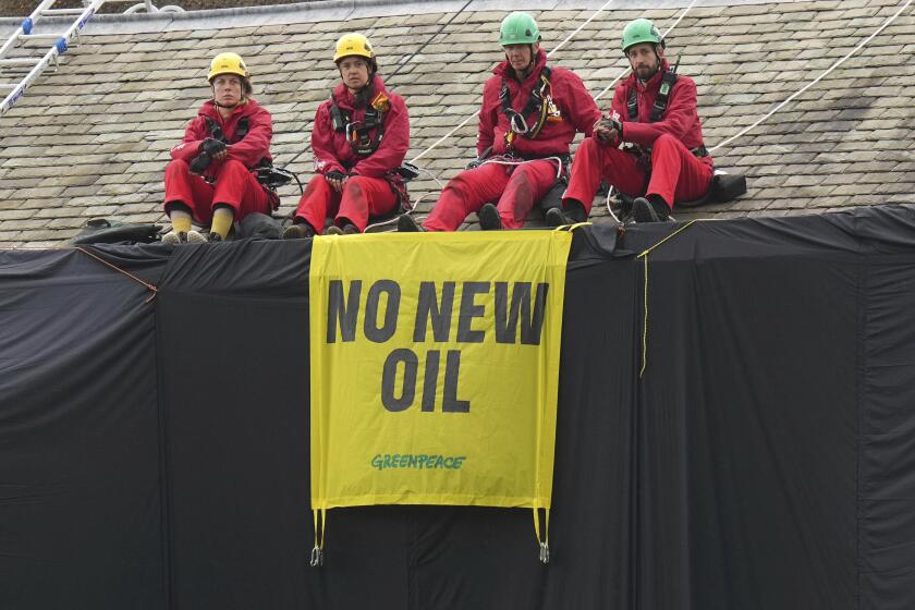 Greenpeace demonstrators protest U.K. prime minister’s oil expansion