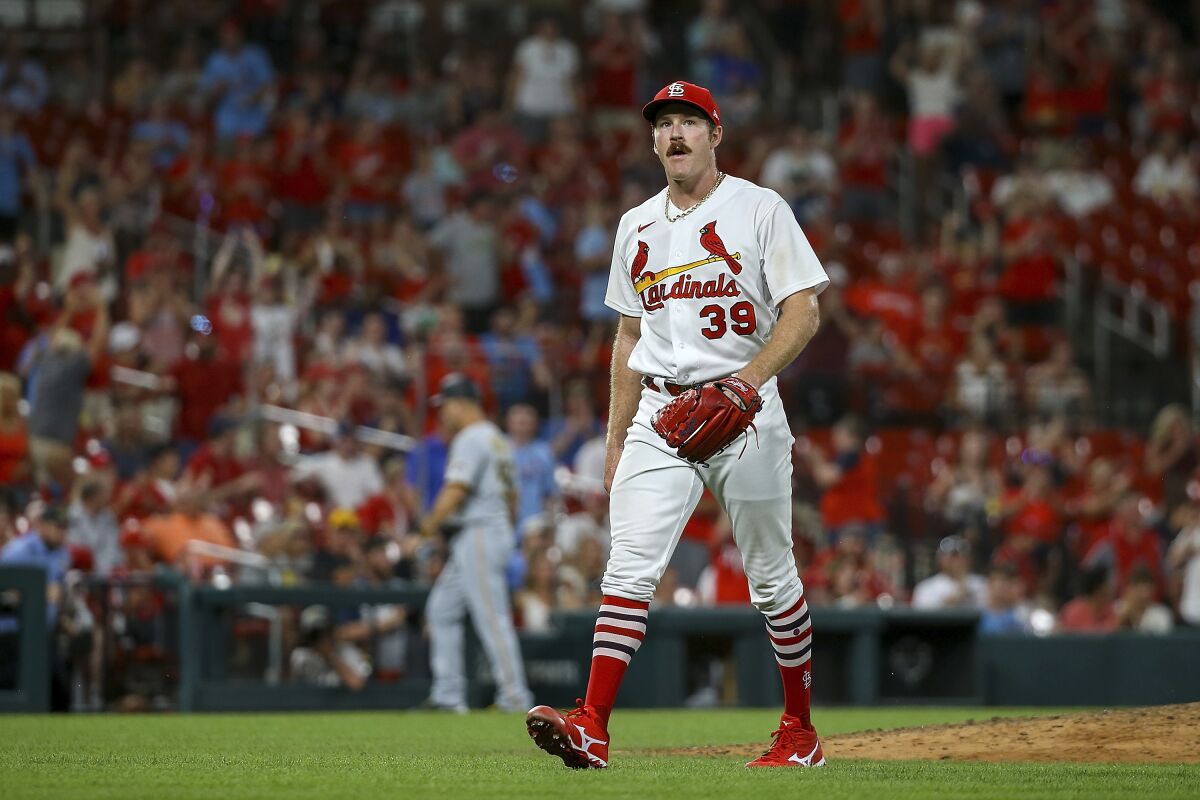St. Louis Cardinals starting pitcher Miles Mikolas walks to the dugout after pitching during the eighth inning in the second game of the baseball team's doubleheader against the Pittsburgh Pirates on Tuesday, June 14, 2022, in St. Louis. (AP Photo/Scott Kane)