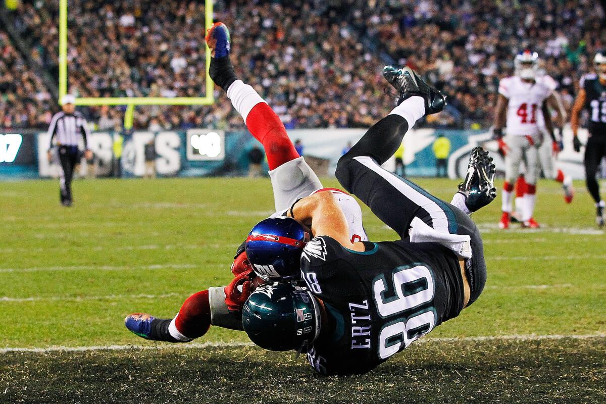 The New York Giants' Landon Collins snatches the ball away from Zach Ertz of the Philadelphia Eagles during the "Monday Night Football" game in Philadelphia on Oct. 19.