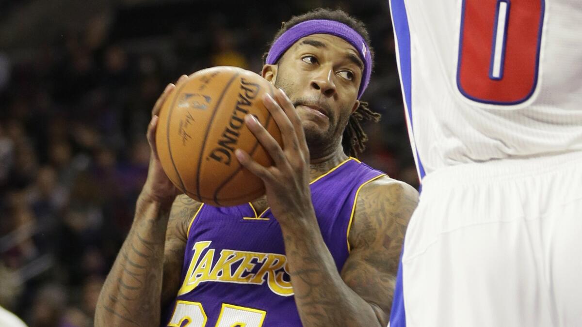 Lakers forward Jordan Hill looks to pass during the second half of a 106-96 victory over the Detroit Pistons on Tuesday.