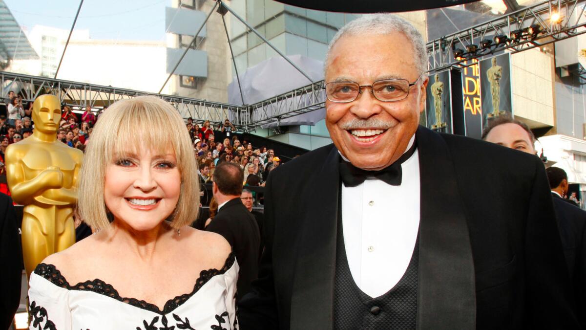 Cecilia Hart with her husband, James Earl Jones, at the Oscars in 2012.