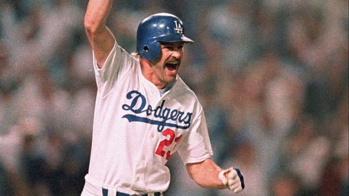 The Dodgers' Kirk Gibson rounds the bases after hitting a game-winning two-run home run in the bottom of the ninth inning to beat the Oakland Athletics in Game 1 of the 1988 World Series.