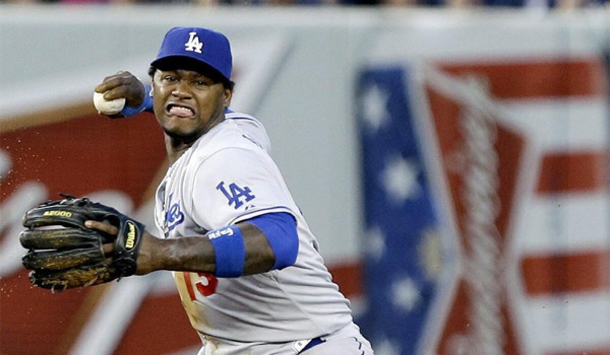 Hanley Ramirez looks to beat out Jayson Nix with a throw to first during the Dodgers' 6-0 victory over the New York Yankees in second game of a doubleheader Wednesday.