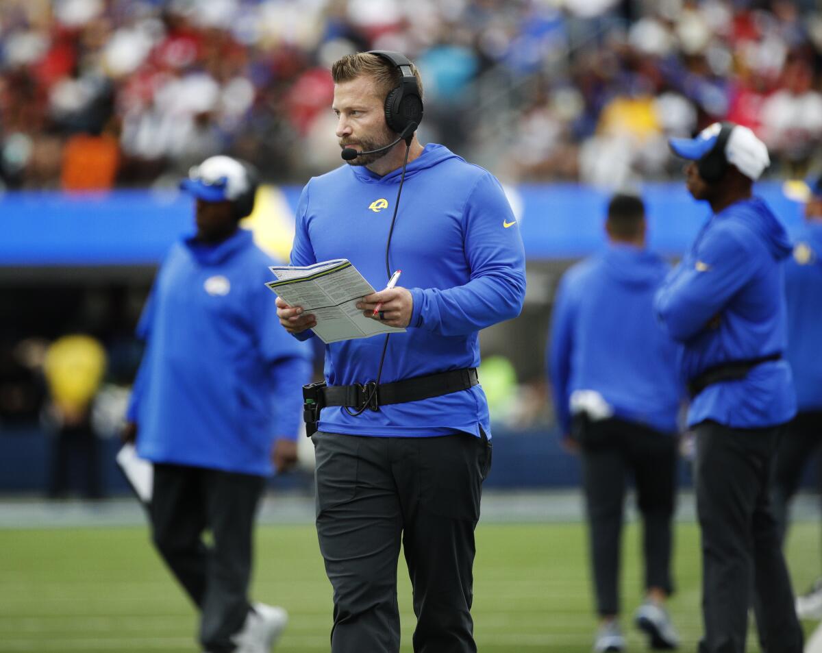 Rams head coach Sean McVay walks the sidelines during a game against the 49ers.